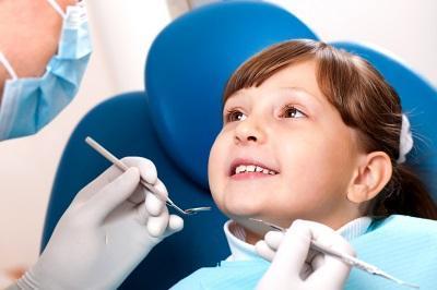 Small girl smiling during general dentistry exam in Annapolis, MD