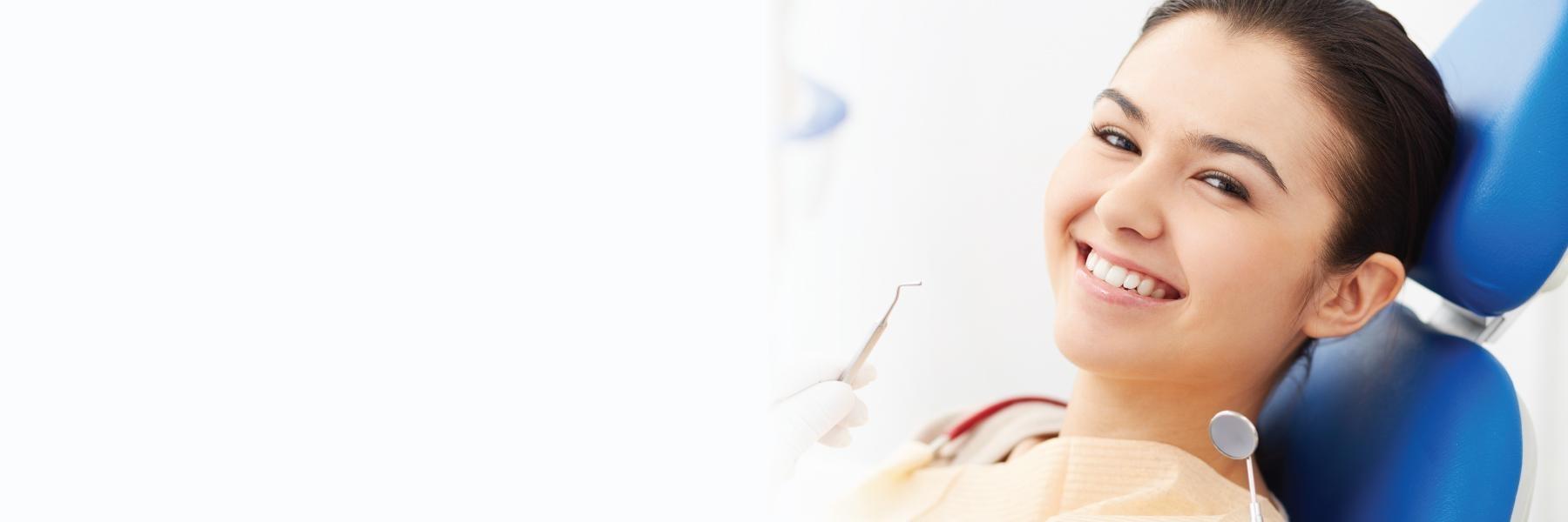 Woman smiling during dental check up in Annapolis, MD