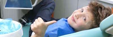 Kid relaxing o dental chai during pediatric dentistry in Annapolis, MD