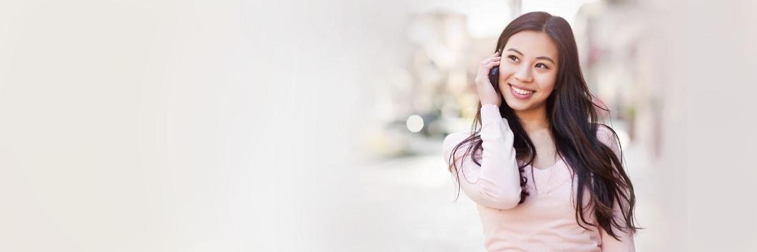Woman talking on phone |after dental emergency treatment in Annapolis, MD