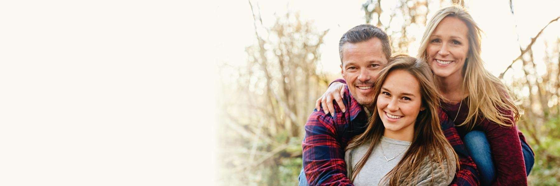 Family smiling after dental emergency treatment at Chesapeake Bay Dentistry