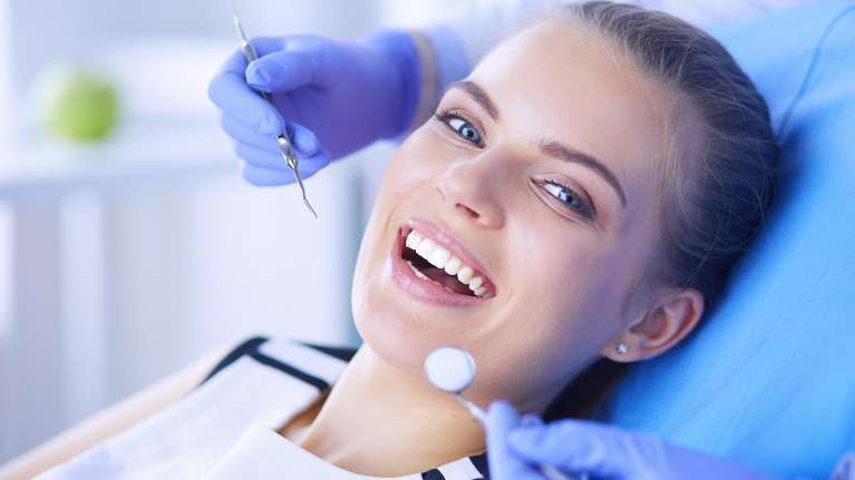 Lady smiling during dental examination at Chesapeake Bay Dentistry