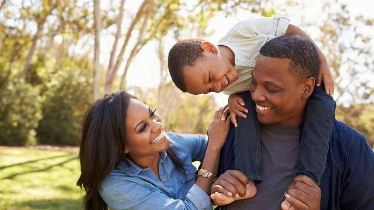 Family smiling after general dentistry in Annapolis, MD
