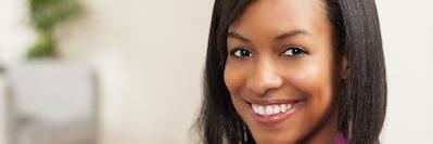 Woman smiling after sedation dentistry exam in Annapolis, MD