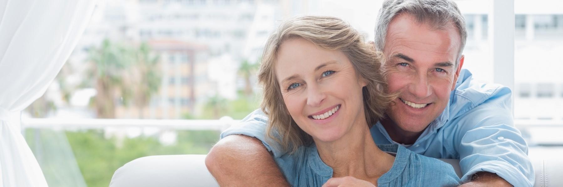 Man and woman hugging | Periodontal Disease Treatment Annapolis MD